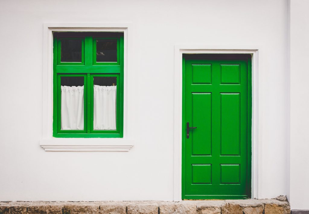 unique green door and window